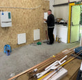 Learner practising copper pipework on the radiator training rigs at The Plumbing School